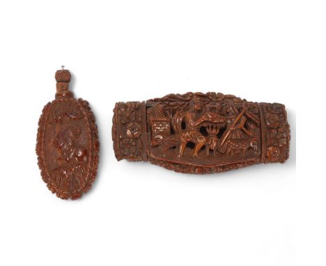 A 19th century coquilla nut box, relief carved and pierced figural decoration, length 8.5cm, together with a relief carved co