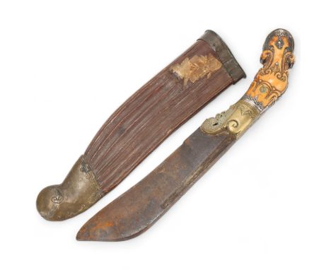 A Sri Lanka ceremonial knife (Piha Kaetta), with carved handle and brass-mounted carved wood scabbard, overall length 34cm 