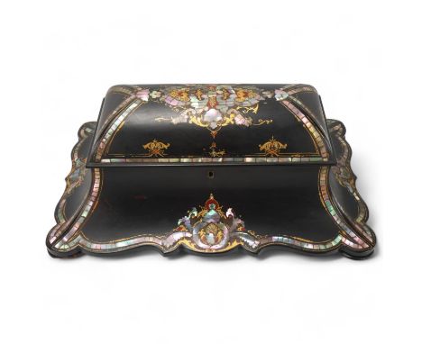 A 19th century papier mache tea caddy, inlaid mother-of-pearl and gilded decoration, with inner lids and glass bowl, width 43