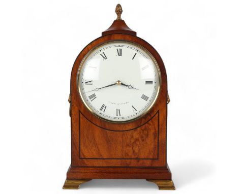 A reproduction mahogany cased dome-top mantel clock, on brass bracket feet, by Comitti of London, height 28cmGood condition a