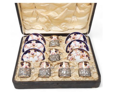 Royal Crown Derby coffee set with silver-mounted cups, hallmarks London 1905, original caseNo damage or restoration, no chips
