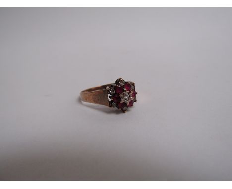 A 9ct gold ruby and diamond chip ring 2.2g