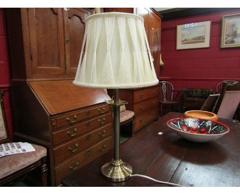 A brass effect table lamp with cream silk pinch pleated thread shade