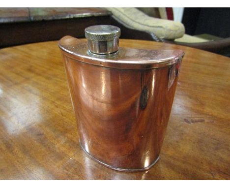 A retro copper hip flask of curved form