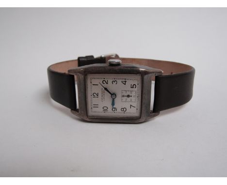 A retro silver cased J.W.Benson, london, square faced manual wind wristwatch with leather strap 