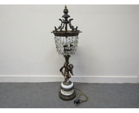 A late 19th/early 20th Century French bronze cherub form figural table lamp with crystal drop shade on plinth base, 89cm tall