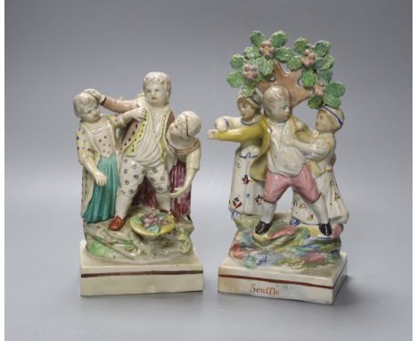 An early 19th century Ralph Wood Staffordshire group 'No Contest', 17.5cm and a similar bocage group, 'Scuffle', 21cmThe latt