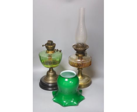 A brass green shade oil lamp and another oil lamp, 53cm