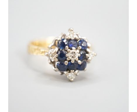 A 1960's 18ct gold, sapphire and diamond cluster ring, size Q, gross weight 5.8 grams.