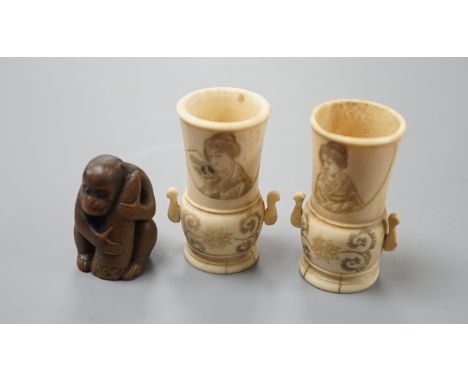 A pair of early 20th century Japanese miniature ivory vases, 5.3 cm, engraved with a lady and a wood netsuke in the form of a