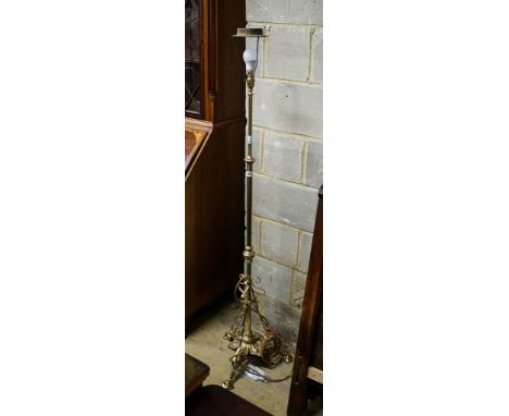 An Edwardian brass telescopic lamp standard, with Benson style foliate base, height 140cm