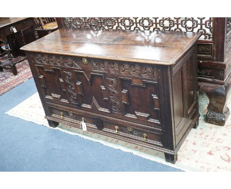 A William and Mary carved oak mule chest with K M initialled frieze and triple panelled front, length 132cm, depth 51cm, heig
