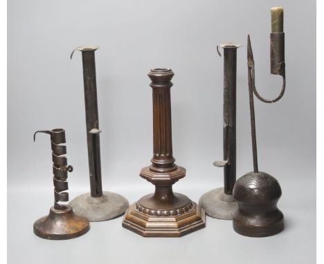 A wrought iron taperstick, a pair of iron telescopic candlesticks, a spiral candlestick, all Georgian and a 17th century styl