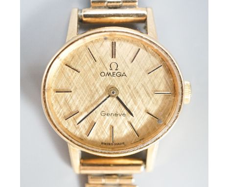 A lady's 1970's 9ct gold Omega manual wind wrist watch, on a 9ct gold bracelet, overall 18.5cm,gross weight 19.2 grams.