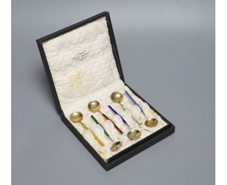 A cased set of six Norwegian gilt white metal and enamel coffee spoons.