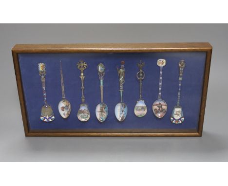 Eight Continental 800 standard silver and enamel ‘Egypt’ souvenir spoons, early 20th century, one with hinged sarcophagus ter