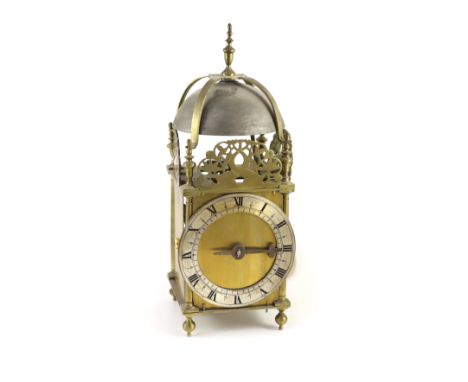 A 17th century style brass lantern clockwith single hand and silvered Roman chapter ring, with lead weight and brass pendulum