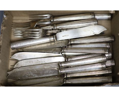 Twelve George V silver fish forks and eleven matching fish knives, George Howson, Sheffield, 1933, loaded handles.