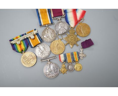 WWI and George V medals to include -a pair to 36125 PTE. E. E. STOCKING. THE QUEEN’S R., a War medal to J.14635 S. J. NORMAN.