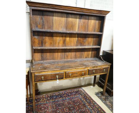 A George III oak dresser, with two shelf rack and three long drawers, on chamfered legs, width 167cm, depth 49cm, height 193c