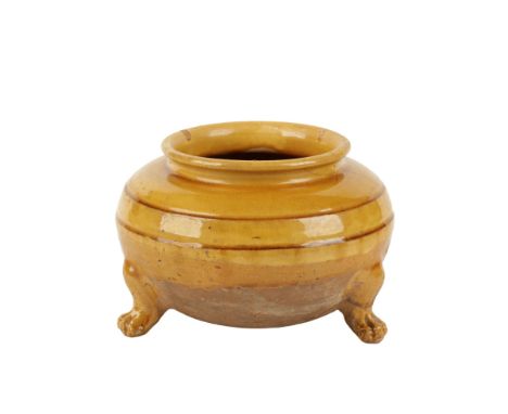 BROWN-GLAZED TRIPOD JAR, TANG DYNASTY, the baluster sides with a rich golden-brown glaze, 21cm diam 