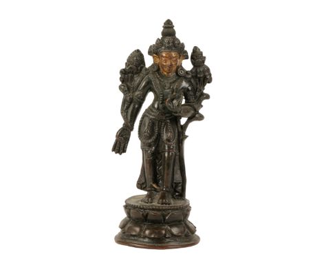 BRONZE FIGURE OF AVALOTESVARA, SINO-TIBETAN, 17TH / 18TH CENTURY, the standing figure on a lotus petal base, with hands in ab