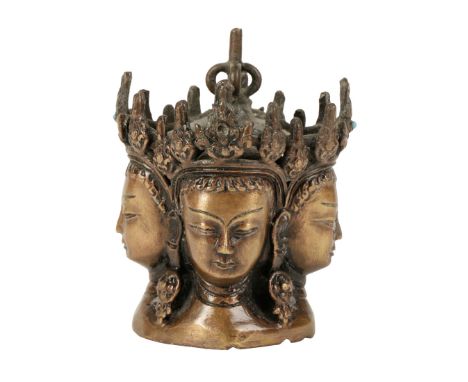 BRONZE STAFF FINIAL, TIBET, 18TH / 19TH CENTURY, the four sided finial cast with Vairocana heads wearing flaming diadems, set