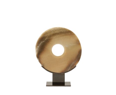 JADE DISC, NEOLITHIC STYLE OF THE LIANGZHU CULTURE, the golden brown stone with celadon and creamy mottling, with a soft lust