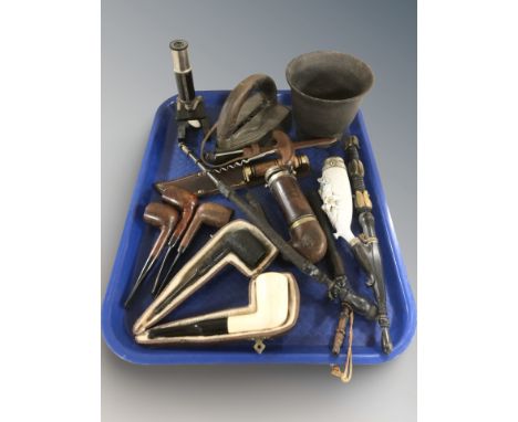 A group of pipes, small microscope, corkscrew, hunting knife, etc.