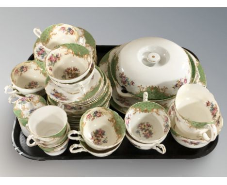 Forty seven pieces of Paragon green and gilt floral tea china.