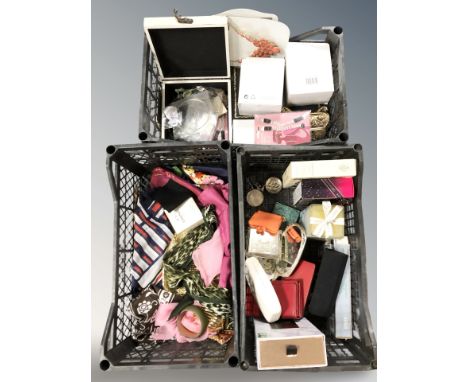 A group of silk scarves, modern jewellery boxes, Chanel No.5 soap in cellophane wrapping, other fashion items, cosmetic gift 