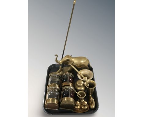 A brass figure of an elephant, mortars and pestles, fire poker in the form of a golf putter, miniature ship's style lamps, et