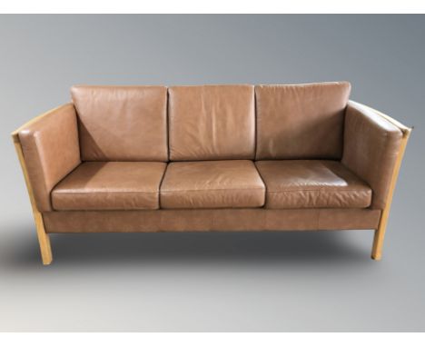 A late 20th century Danish wooden framed tan leather three seater settee, 200 cm x 84 cm x 80 cm.