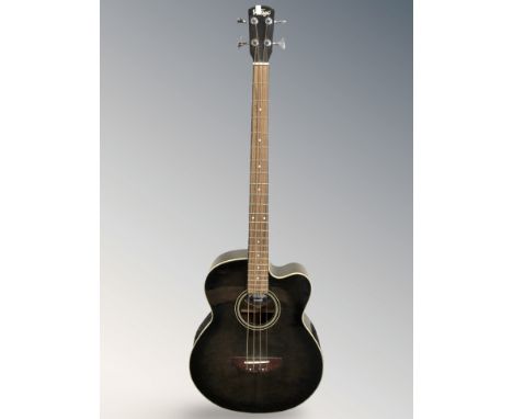 A Vintage electro acoustic bass guitar, serial VCB430TVK 