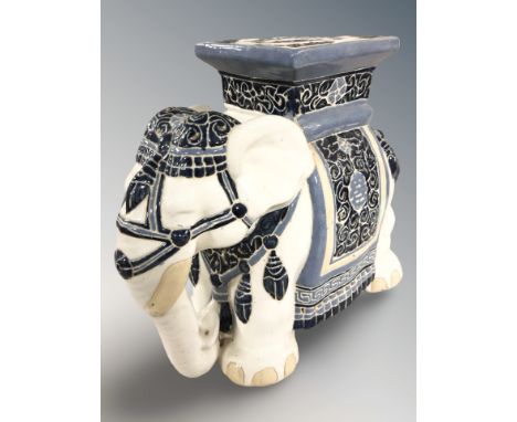 A ceramic elephant plant stand, height 41 cm.