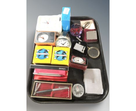 A group of pens including Parker, lighters including Polo and Ronson, a Caithness lovehearts glass paperweight, travel timepi