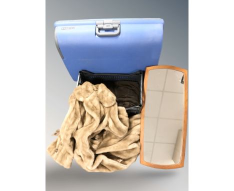 A simulated fur coat and an Oaklands suede jacket with sheepskin lining, a luggage case and a 1970's frameless mirror.