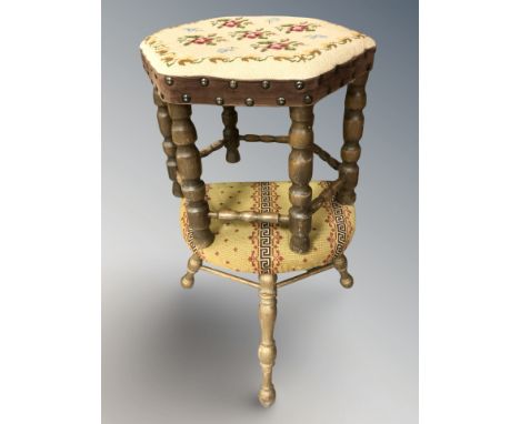 A hexagonal tapestry footstool and a tripod stool 