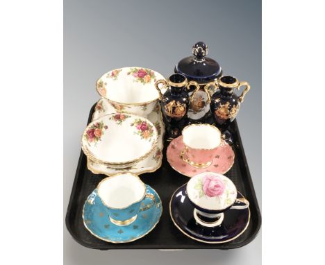 A West German cobalt blue porcelain jar and cover, similar pair of vases, four pieces of Royal Albert Old Country Roses porce