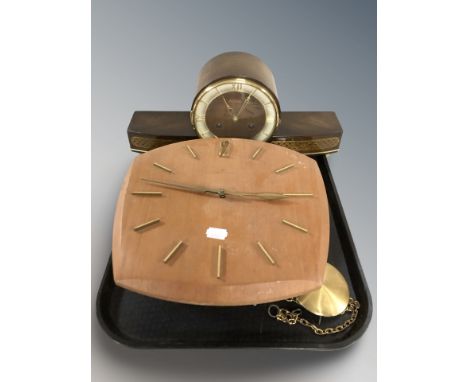 A teak Junghans wall clock, with pendulum, no weights, and a further mantel clock signed 'Amigo'.
