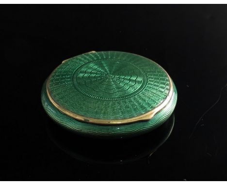 A guilloche compact of circular form 