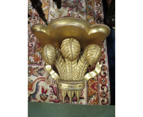 A gilt wall bracket with Prince of Wales feather design 
