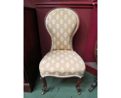 A Victorian mahogany lady's spoon back nursing chair 