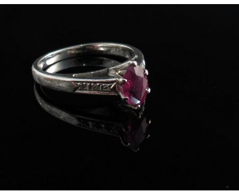 A ladies ring set with facetted ruby, shank marked 18ct