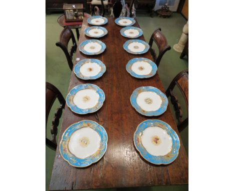 A set of twelve late 18th Century/early 19th Century cabinet plates of lobed form, turquoise border with enamelled butterflie