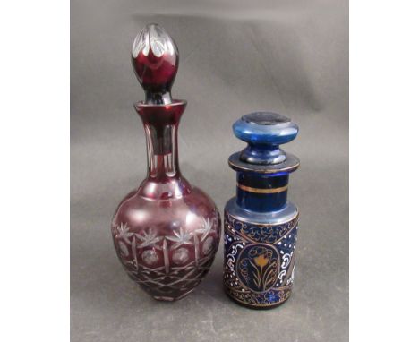 A Bohemian blue glass decanter and a Cranberry glass example 