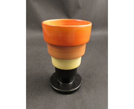 A Clarice Cliff vase of ribbed form, base restored