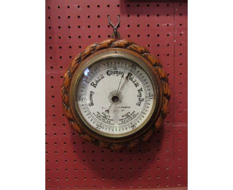 An oak rope wall barometer marble face  