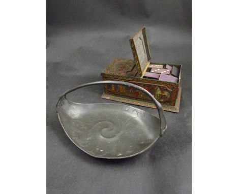 A Huntley and Palmers Ltd biscuit tin with jousting detail and an Art Nouveau style pewter dish