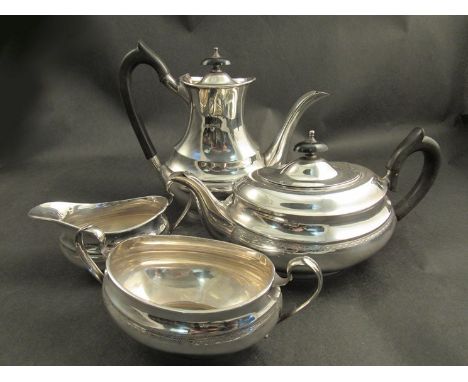 Emile Viner Sheffield 1940 silver tea service comprising of a silver sugar bowl, cream jug, teapot and coffee/hot water pot 1